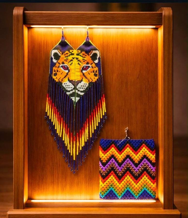 Long beaded leopard face earrings displayed beside a bright zigzag beaded cuff