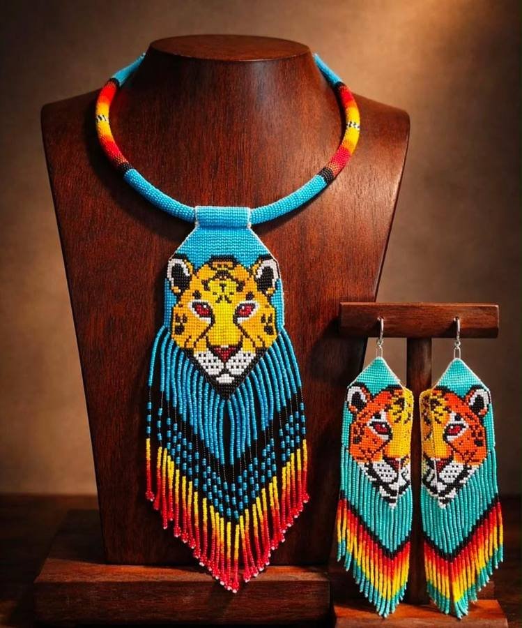 Turquoise beaded necklace with a leopard face pendant and matching fringed earrings