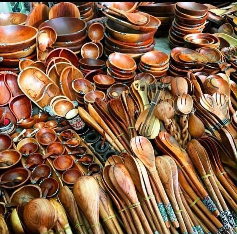Market display of hand-turned wooden bowls, salad servers and spoons