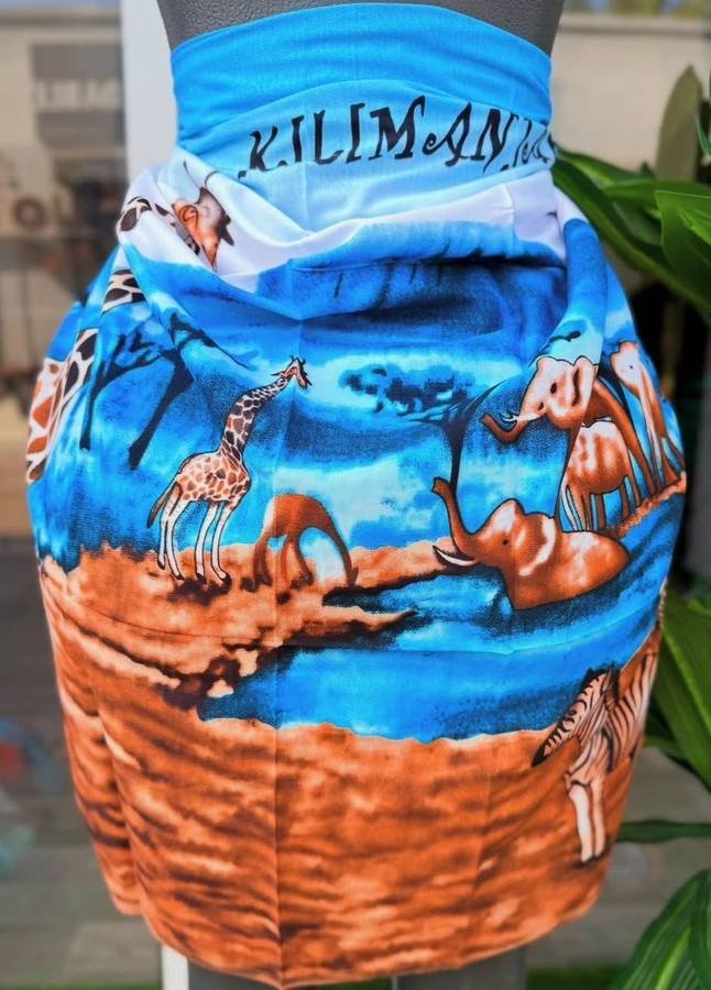 Wrap skirt printed with Kilimanjaro, giraffes, elephants and zebra on a mannequin