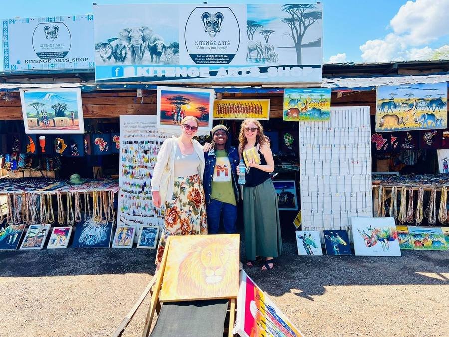 The Kitenge Arts shop front at Chemka Hot Springs with visitors browsing