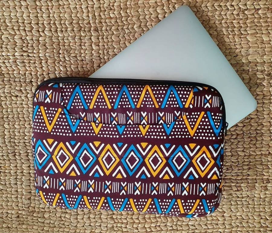 Padded laptop sleeve in maroon, blue, gold and white kitenge print with a zip closure